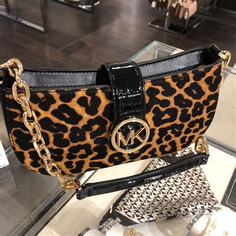 michael kors bag with lion|Michael Kors black leopard bag.